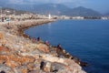 Vacationers people and fishermen on a stone jetty. Royalty Free Stock Photo