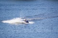 Vacationers ride boats and boats on the river.