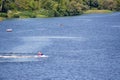 Vacationers ride boats and boats on the river