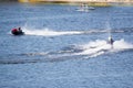 Vacationers ride boats and boats on the river.