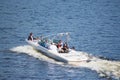 Vacationers ride boats and boats on the river.