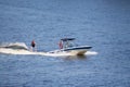 Vacationers ride boats and boats on the river.