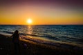 Vacationers On The Sunset Shore