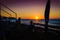 Vacationers On The Sunset Shore