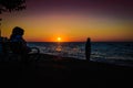 Vacationers On The Sunset Shore