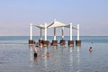 Vacationers and tourists bathe in the Dead Sea in Ein Bokek Royalty Free Stock Photo