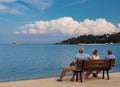 Vacationers tourists on the bench on the right tourist town of the Greek island of Kefalonia in Greece on the Ionian Sea coast in Royalty Free Stock Photo