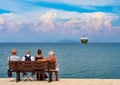 Vacationers tourists on the bench on the right tourist town of the Greek island of Kefalonia in Greece on the Ionian Sea coast in Royalty Free Stock Photo