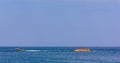 Vacationers tourists ride an inflatable banana in the sea