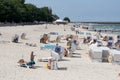 Vacationers on the use roofed beach chairs