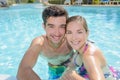 Vacationing couple in pool Royalty Free Stock Photo