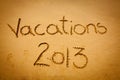 Vacations 2013 written on sand - on the beach Royalty Free Stock Photo