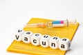 Vaccinate; vaccine written with dice Royalty Free Stock Photo