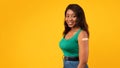 Vaccinated African American Lady Showing Arm After Vaccination, Yellow Background