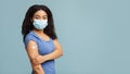 Vaccinated african american young woman showing arm after covid-19 vaccine injection, blue studio background, panorama