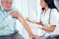 Vaccinating An Elderly Person Royalty Free Stock Photo