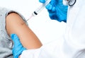 Vaccination. Doctor injecting flu vaccine to patient`s arm. Royalty Free Stock Photo