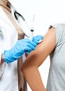 Vaccination. Doctor injecting flu vaccine to patient`s arm. Royalty Free Stock Photo