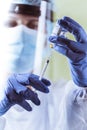 Vaccination, doctor in protective clothes with syringe and ampule Royalty Free Stock Photo