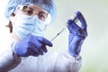 Vaccination, doctor in protective clothes with syringe and ampule Royalty Free Stock Photo