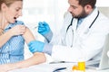 Vaccination. Flu shot. Doctor injecting flu vaccine to patient`s arm Royalty Free Stock Photo