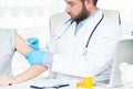 Vaccination. Flu shot. Doctor injecting flu vaccine to patient`s arm Royalty Free Stock Photo