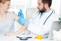 Vaccination. Flu shot. Doctor injecting flu vaccine to patient`s arm Royalty Free Stock Photo