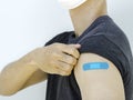 Vaccinations, bandage plaster on vaccinated people`s arm concept. Royalty Free Stock Photo