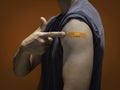 Vaccinations, bandage plaster on vaccinated people`s arm concept. Royalty Free Stock Photo