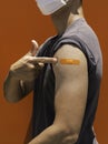 Vaccinations, bandage plaster on vaccinated people`s arm concept. Royalty Free Stock Photo