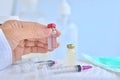 Vaccine bottle in the hands of  doctor / experimenter the vaccine to prevent and treat viruses and syringe Covid-19Ã¢â¬â¹ concept Royalty Free Stock Photo