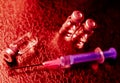 Vaccine bottles and needle