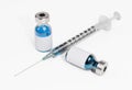 Vaccine Bottles and Syringe isolated on White Background