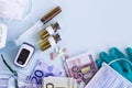 Vaccine bottles, syringes, medical equipment on light blue surface