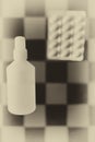 Vaccine and medicine on retro checkerboard background. Medicine health and success research problems concept