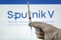 The vaccine Sputnik V against coronovirus infection covid 19 and a syringe on white background. Royalty Free Stock Photo