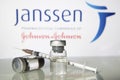 Vaccine vials against Janssen logo
