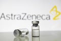 Vaccine vials with AstraZeneca Plc logo.