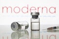 Vaccine vials and syringe with Moderna Inc logo Royalty Free Stock Photo