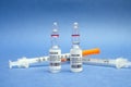 Vaccines and syringes on blue background for prevention,immunization and treatment from corona virus infection covid 19. Royalty Free Stock Photo