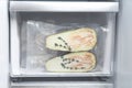 Vacuum bags with different products in fridge. Food storage