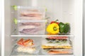 Vacuum bags with different products in fridge. Food storage