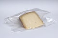Vacuum cheese in a white background
