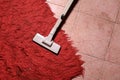 Vacuum cleaner on extremely dirty carpet. Copy space. Royalty Free Stock Photo