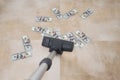 Vacuum cleaner suck usd dollar banknotes. Launder money concept Royalty Free Stock Photo