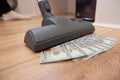 Vacuum cleaner suck usd dollar banknotes. Launder money concept Royalty Free Stock Photo