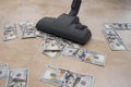 Vacuum cleaner suck usd dollar banknotes. Launder money concept Royalty Free Stock Photo