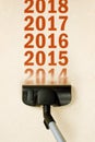 Vacuum Cleaner sweeping year number 2014 from carpet Royalty Free Stock Photo