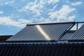 Vacuum solar water heating system on the house roof. Royalty Free Stock Photo