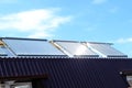 Vacuum solar water heating system on the house roof. Royalty Free Stock Photo